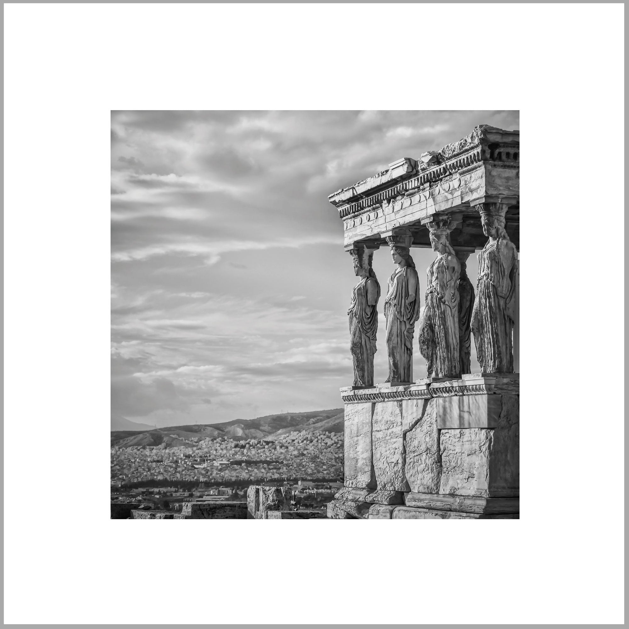 a classical architectural structure with a row of statues on the front, overlooking a cityscape in the background.