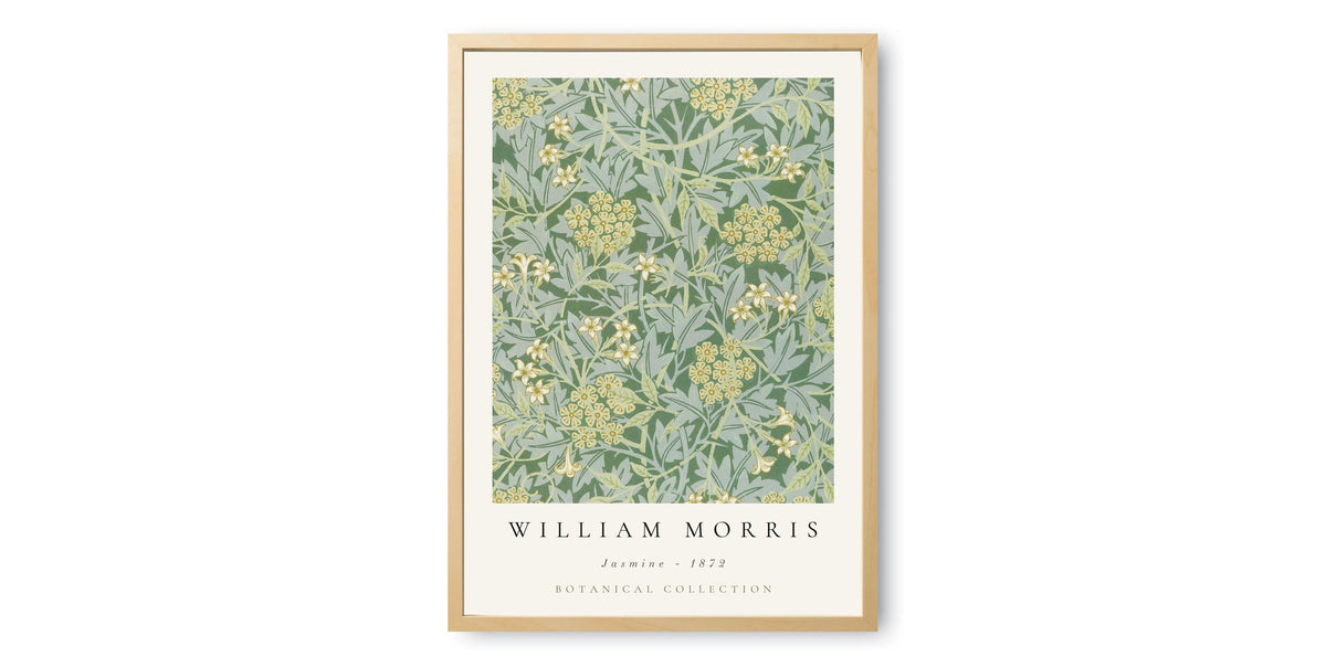 A framed poster featuring a repeating pattern of green leaves and yellow flowers, with the text "William Morris" and "Jasmine - 1920 Botanical Collection" below it.